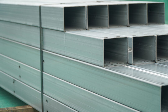 Stacked Galvanized Steel Channels with Pre drilled Holes in a Warehouse