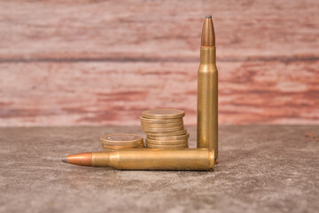 rifle bullets coins ammunition price war © Ana Maria
