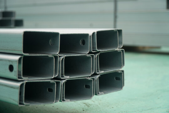 Stacked Galvanized Steel C channels with Pre drilled Holes in a Warehouse