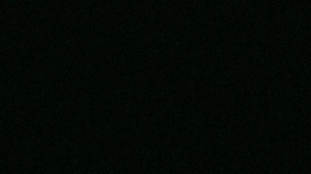 Dark textured surface with subtle noise pattern resembling static interference
