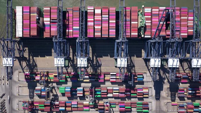 Hyperlapse View of Cargo Ship Loading and Unloading Containers at a Busy Port Terminal