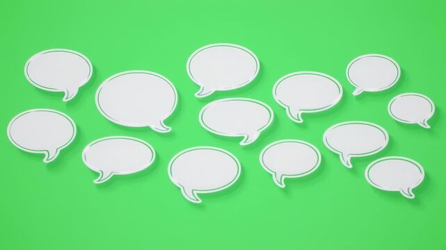 Many white speech bubbles arranged on a vibrant green background with subtle cinematic motion and soft lighting