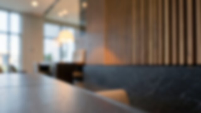 Blurred modern executive office interior featuring wood paneling and warm lighting, designed ideally as virtual meeting backgrounds, presentation slides, or corporate website hero sections