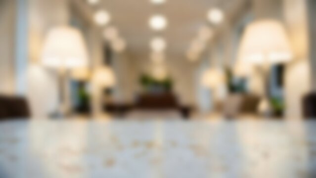 blurred luxury hotel lobby interior background with empty marble table top surface for product mockup display or elegant website banner design