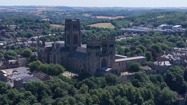 DURHAM, UK - AUGUST 2026: 4K scenic aerial shot of historic Durham Cathedral, Durham Castle, River Wear and cityscape in County Durham (Color Graded)
