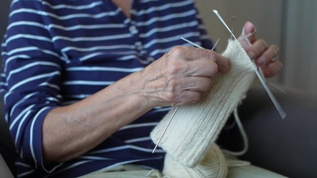 Close up of woman's hands knitting