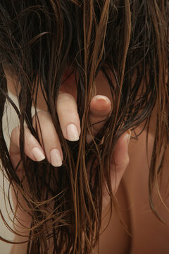 Close Up of Hand Running Through Wet Hair
