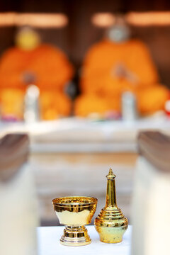 Golden Buddhist Holy Water Bowl and Sprinkler in Thai Wedding Blessing Ceremony