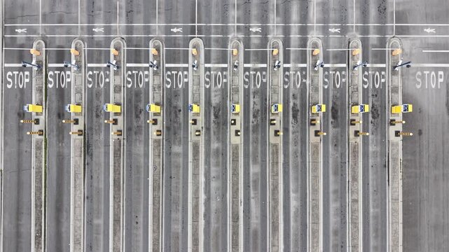 Empty toll plaza checkpoint on highway aerial view
