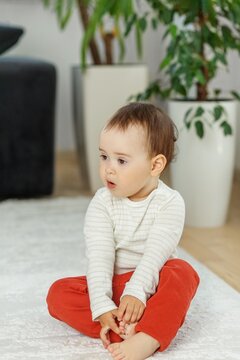 Toddler with Surprised Expression Looking to Side at Home