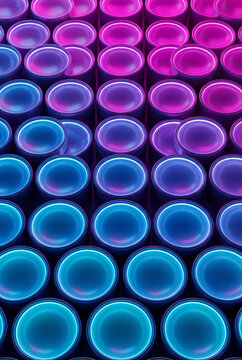 Vertical 3D circle grid transitioning from magenta to cyan