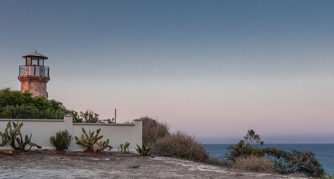 View of the historic Pervolia Lighthouse (also known as the Cape Kiti Lighthouse) built in 1860, and still operational, located at Cape Kiti, nearly 13 kilometers southwest of Larnaca, Cyprus 