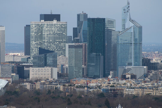 Paris business district skyline with Tour First and city roofs with copy space
