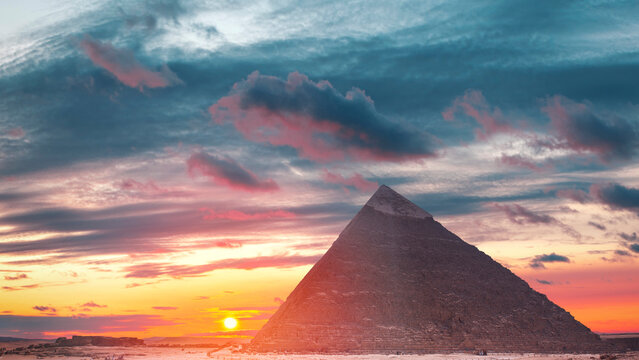 Majestic Giza pyramid at dramatic fiery sunset in Egypt with copy space