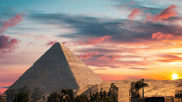 Ancient Great Pyramid of Giza at beautiful golden sunset in Egypt with copy space