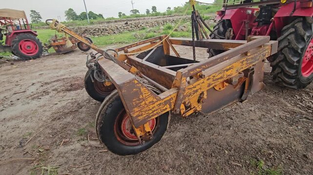 Tractor-Drawn Agricultural Land Leveler Equipment in Rural Farm Field, Farming Machinery 4K Stock Footage