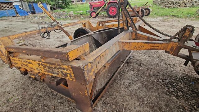 Tractor-Drawn Agricultural Land Leveler Equipment in Rural Farm Field, Farming Machinery 4K Stock Footage