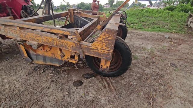 Tractor-Drawn Agricultural Land Leveler Equipment in Rural Farm Field, Farming Machinery 4K Stock Footage