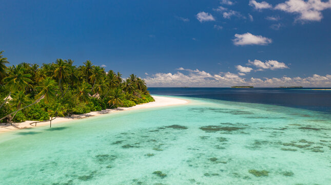 Breathtaking aerial tropical island turquoise reef white sand beach lush palm forest from above. Perfect summer vacation travel landscape paradise. Exotic drone getaway relax scenic coastal backdrop