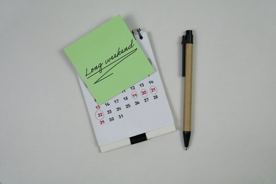 Long Weekend Reminder On Calendar With Pen For Vacation Planning And Time Management. with an white background.