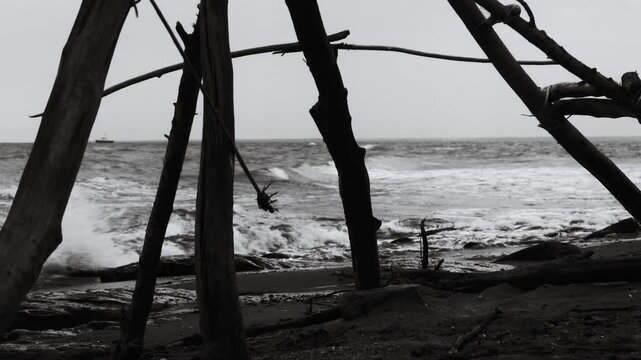 A single-person teepee on a sandy beach, perfect for camping or relaxation