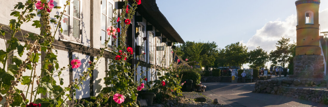 Picturesque summer panorama of the historic timber framed village of Nordby on Samso, with famous yellow bell tower, a top travel destination in Denmark