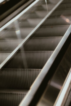 Abstract close-up of an escalator steps and handrail