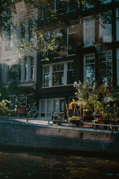 Charming canal scene with flowers and bicycle in Amsterdam