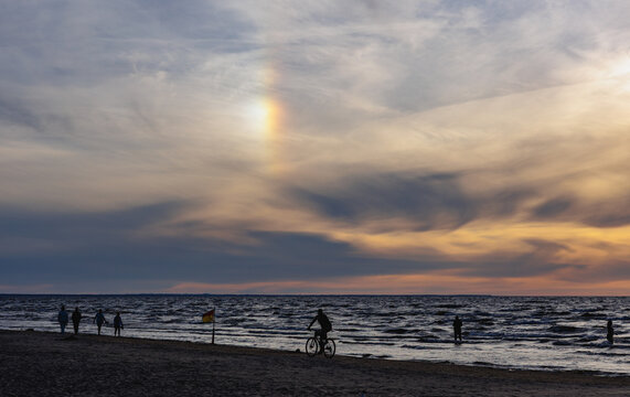 Sun dog and sunset over the Baltic Sea at Majori beach in Jurmala, Latvia