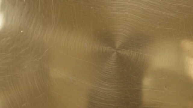 shiny gold metal texture polished golden brass plate closeup view background video