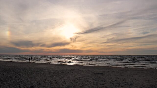 Sun dog and sunset over the Baltic Sea at Majori beach in Jurmala, Latvia