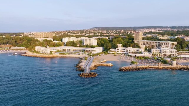 St Constantine Helena beach aerial drone view coastline sandy shore sunbeds umbrellas luxury hotels swimming pools soft sunrise light summer vacation Bulgaria