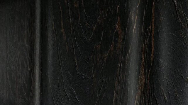 Deep Natural Movement Along Ebony Wooden Boards Revealing Fine Grain Patterns, Smooth Texture, Rich Surface Detail and Bold Premium Character