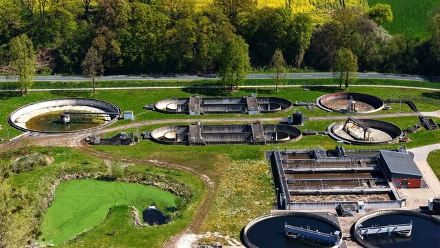 Aerial Wastewater Treatment Plant with Clarifiers and Green Pond