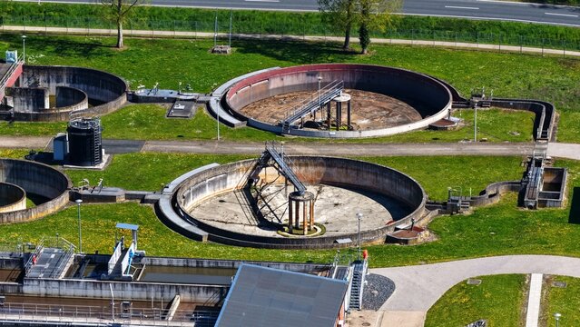 Empty circular clarifiers at wastewater treatment plant from above