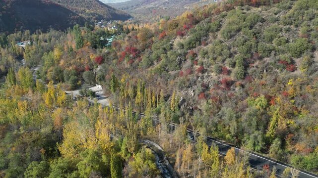Aerial View of Autumn Forest and Mountain Road near Medeu, Almaty