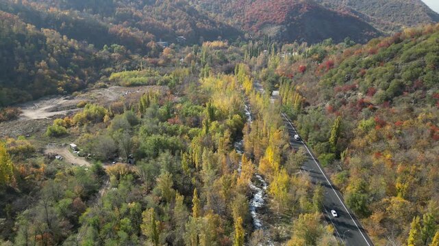 Aerial View of Autumn Mountain Valley and Scenic Road near Almaty