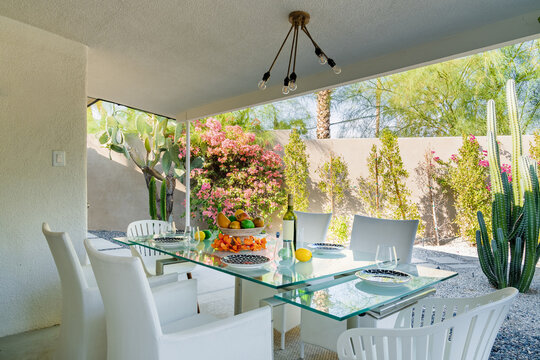 Outdoor Patio Dining with Desert Landscaped Backyard