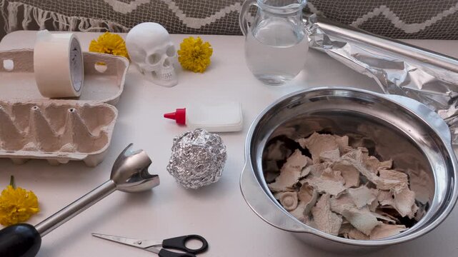 Handmade papermache Dia de los Muertos skull in progress at home workshop