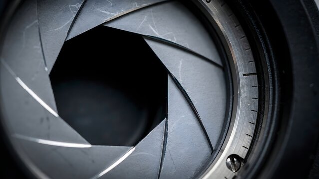 Macro photograph of seven blade camera lens aperture forming circle &ndash; Ideal for photography tools, camera manufacturing, optics, or aperture gear.
