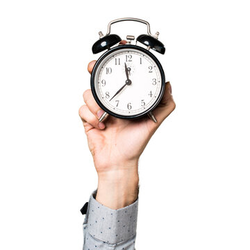 man holding alarm clock. hand man holding vintage clock. Alarm clock on a hand palm isolated on white background, Copy space