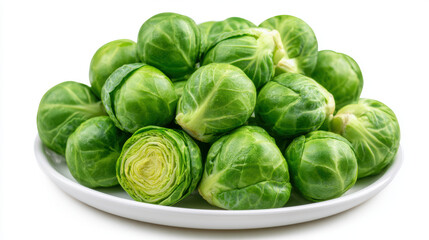 Fototapeta premium Fresh green Brussels sprout vegetable on white plate, healthy organic food closeup with natural texture and vibrant color