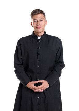 Portrait of young priest in cassock on white background