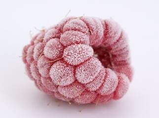 One frozen red raspberry isolated on white © New Africa