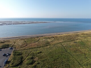Aerial drone 4K view of Leasowe shoreline with warm sun across coastal greenland Leasowe Wirral © Wirral Views