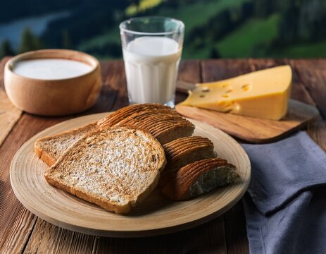 traditional swiss breakfast with sliced bread cheese and milk on rustic wooden table switzerland breakfast traditional delicious appetizer homemade nutrition farmhouse culinary