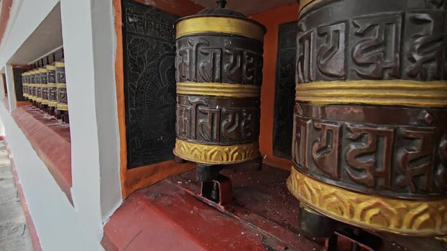 Large Tibetan Buddhist Prayer Wheels, Ornate Mani Wheels with Buddhist Mantras Along Temple Walkway, Spiritual Religious Practice, Buddhism, Himalayan Culture and Heritage