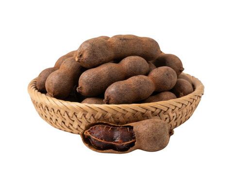 Fresh tamarind fruits in a woven basket, isolated on transparent background