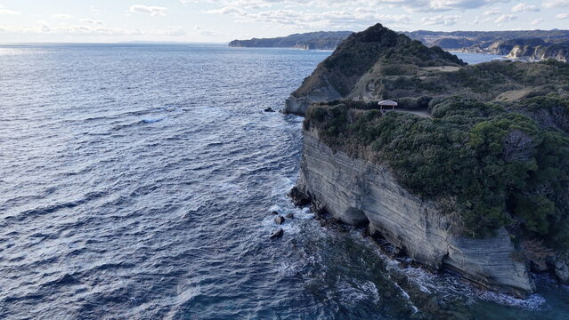 Aerial view of Ubara Utopia, a scenic coastal park with rugged cliffs, lush greenery, and rocky shoreline overlooking the Pacific Ocean in Katsuura, Chiba, Japan.