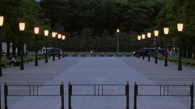 Twilight in Tokyo  :  Boulevard Lights Begin to Glow Amidst the Flow of Traffic, Commuters, and Joggers  |  Marunouchi, Tokyo, Japan